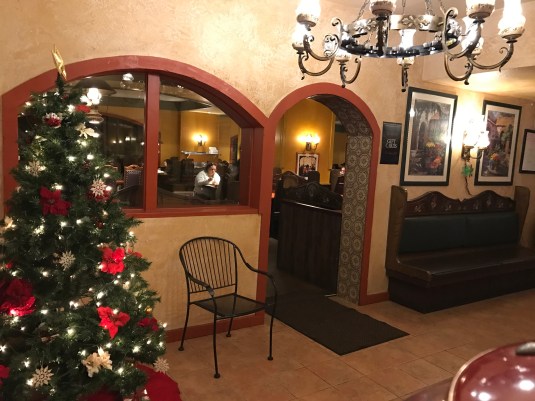 Cozy Tio Leo's Mexican Restaurant with festive tree, perfect for holiday gatherings.