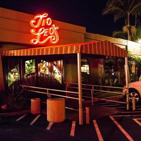 Tio Leo's Mexican Restaurant entrance with neon sign, ideal for events and gatherings.