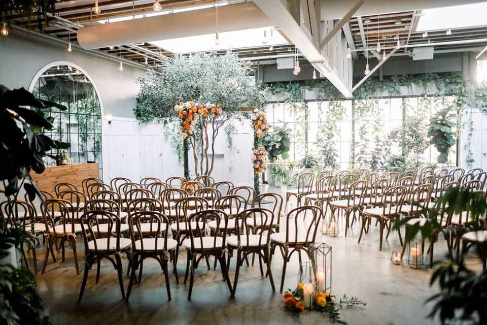 Elegant event space with lush greenery, perfect for intimate gatherings and ceremonies.
