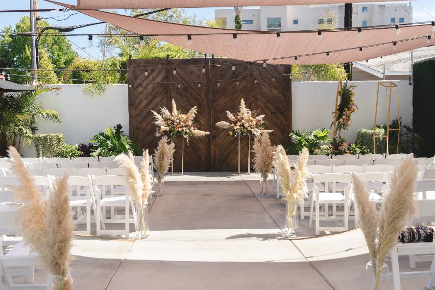 "Love Patio at FruitCraft: elegant outdoor wedding venue with floral decor and string lights."