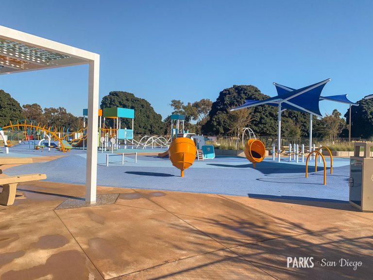 Vibrant outdoor water play area at Tecolote Recreation Center for family events.