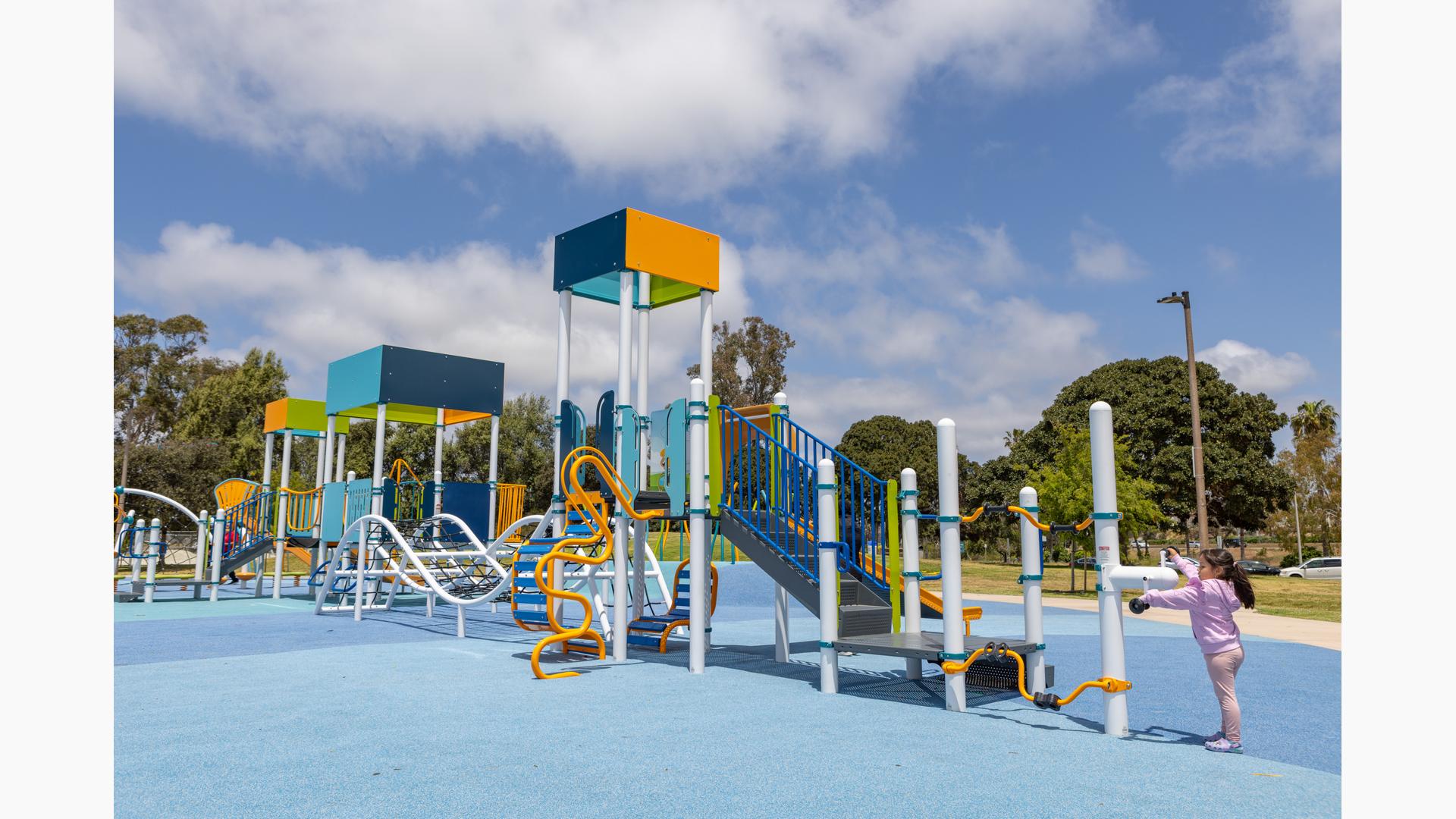 Vibrant playground at Tecolote Recreation Center for family-friendly events and gatherings.