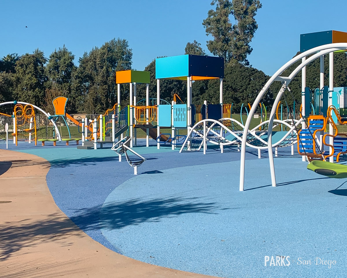 Colorful playground at Tecolote Recreation Center for family-friendly events.