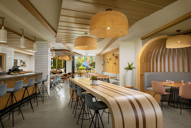 Modern Westerly Public House venue with communal table for meetings and events.