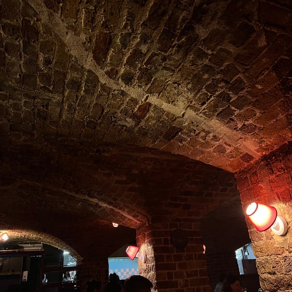 Rustic brick-walled venue with arched ceiling for intimate events in Brixton.