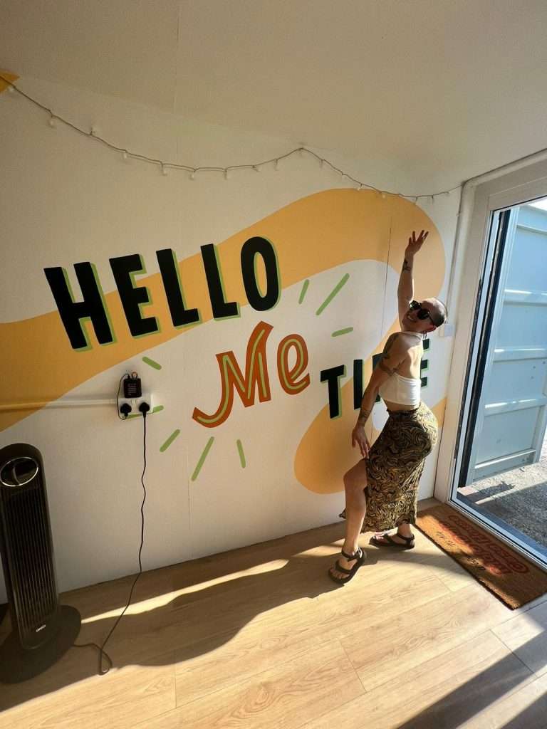 Vibrant event space with playful mural for networking and workshops.