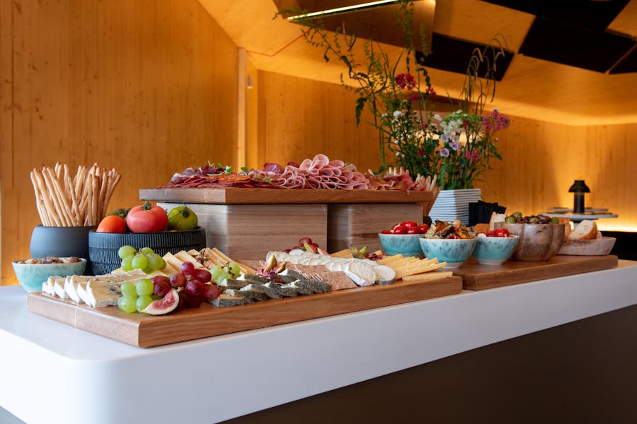 Elegant cheese and charcuterie display at Oceanbird Lounge, ABBA Voyage event catering.