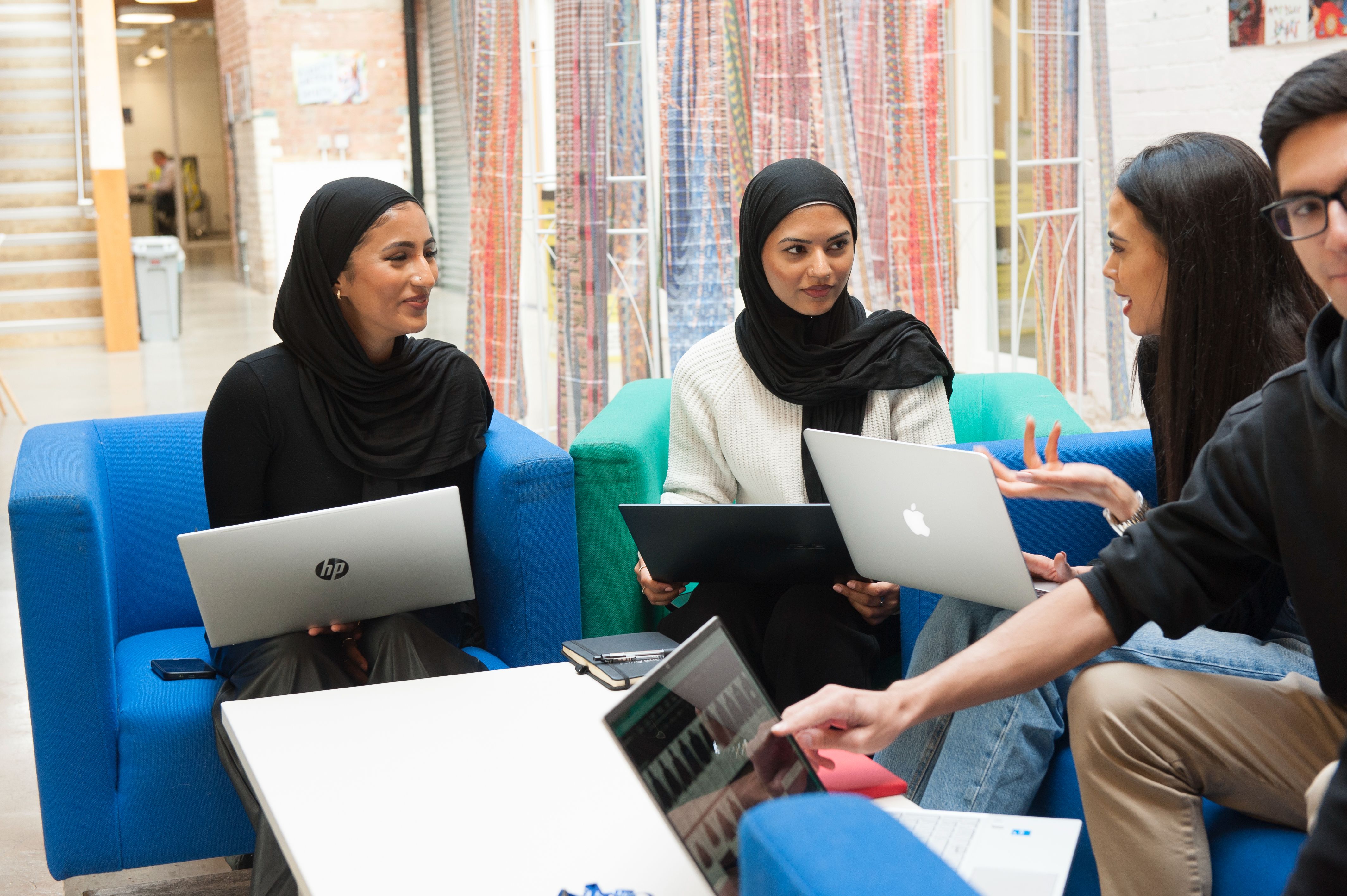 Collaborative meeting room with vibrant seating for workshops and team-building events.