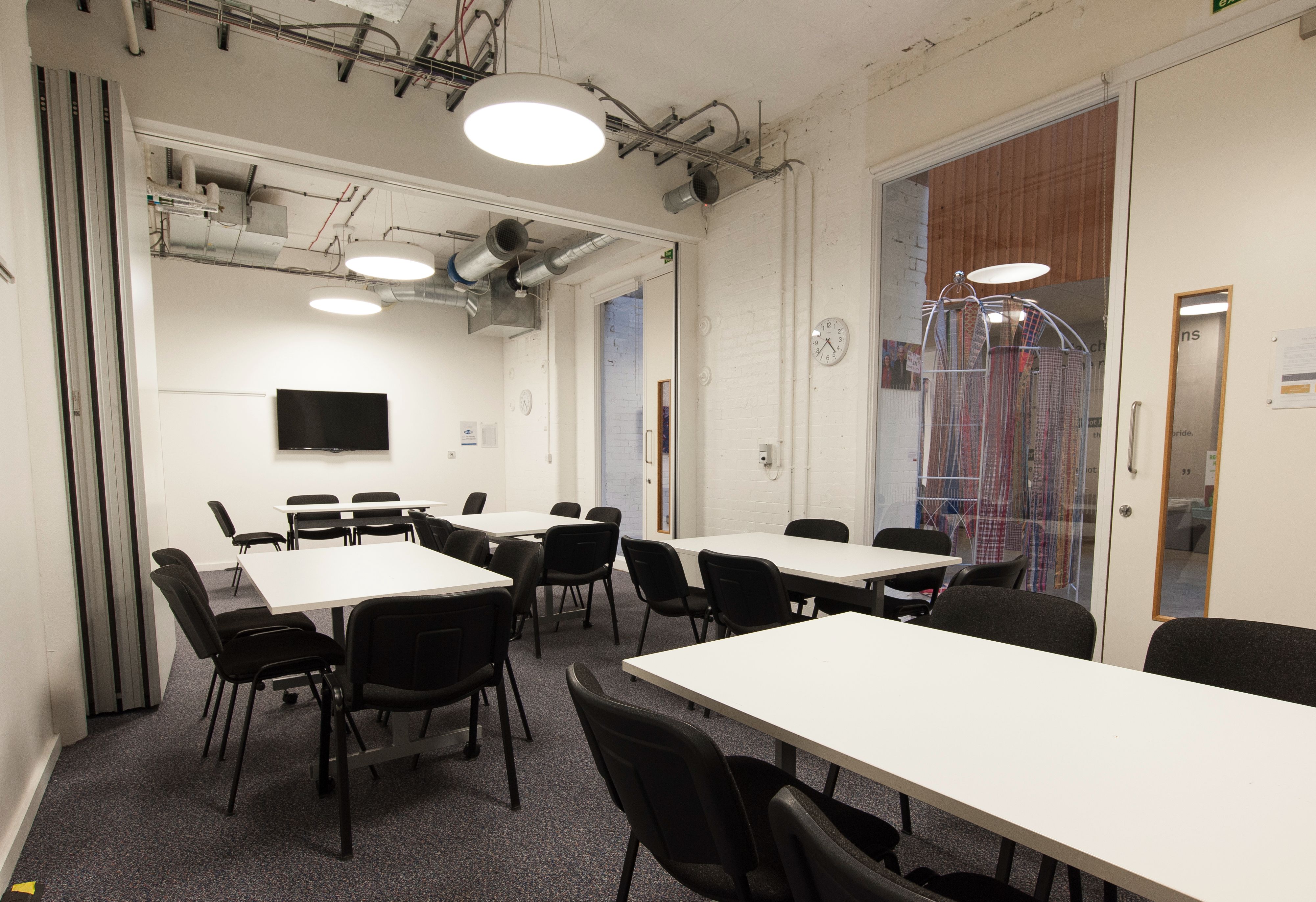Versatile meeting room with flexible seating for workshops and team meetings at The Foundry.