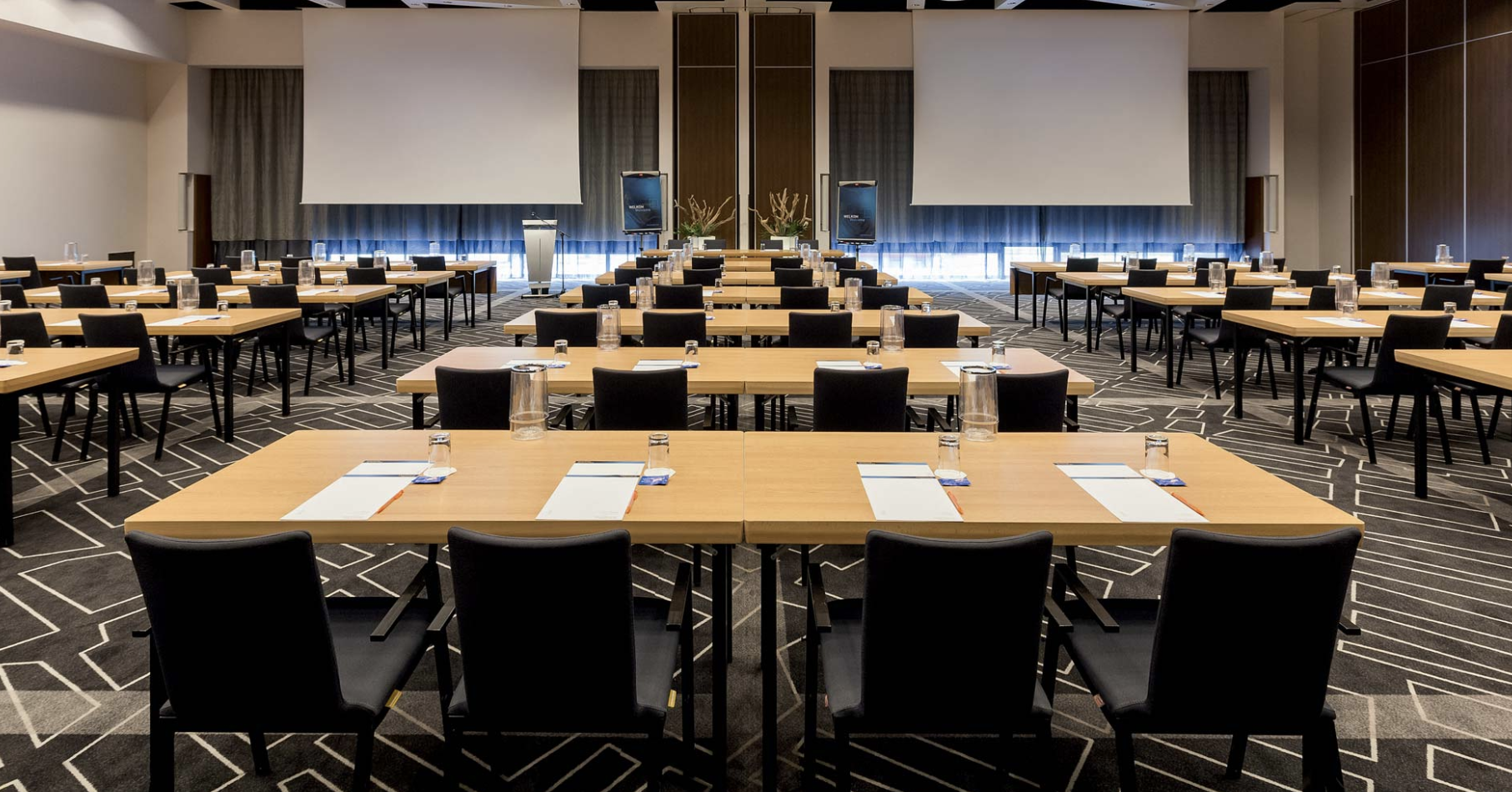 Meeting room at Novotel Amsterdam City, classroom setup for conferences and workshops.