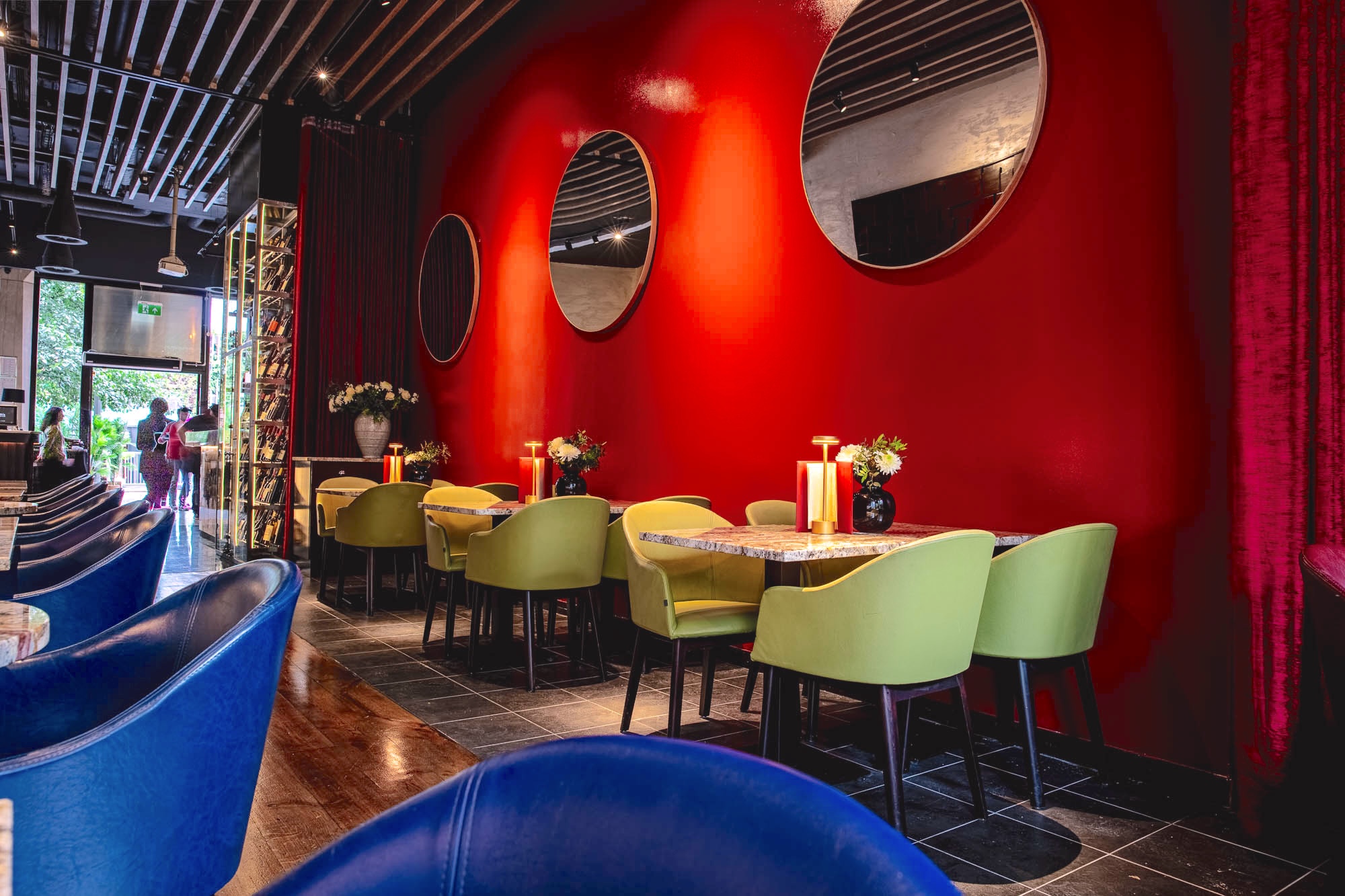 Regent Room at Smith's Bar & Grill: vibrant event space with red wall, ideal for meetings.