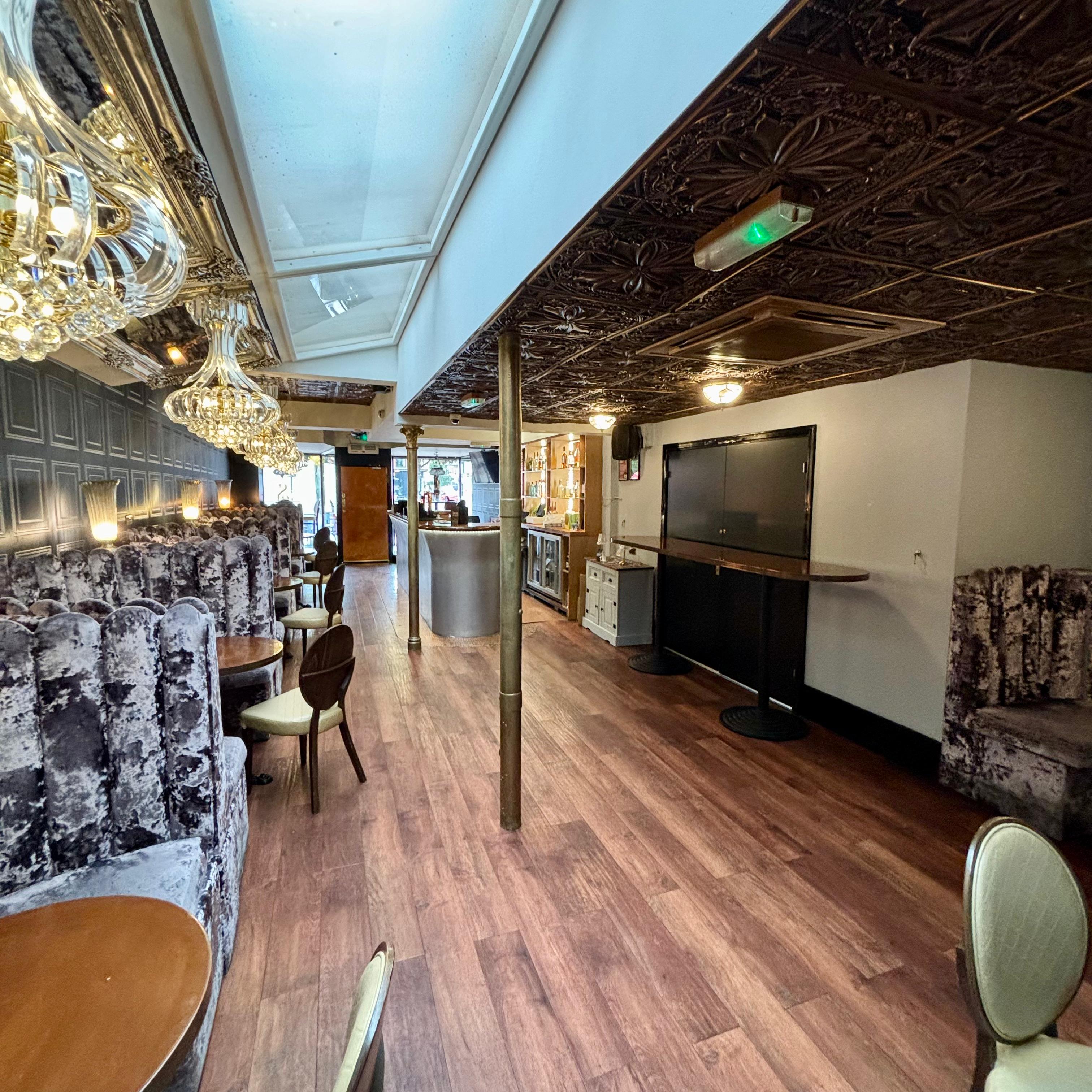 Stylish event space in Sinclairs Bar with plush seating for corporate events and gatherings.