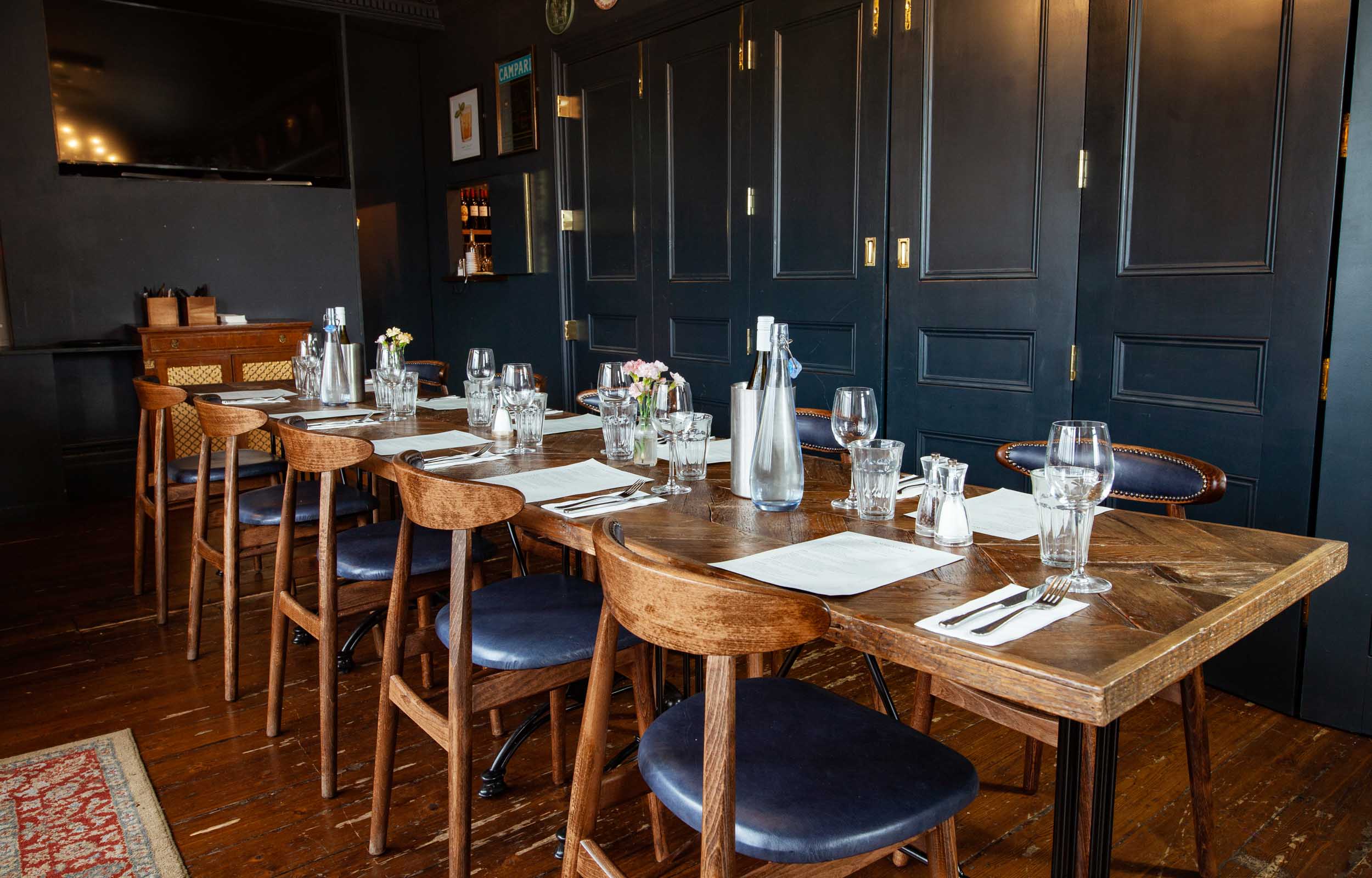 Elegant dining setup in The Railway's First Floor Lounge for private events.