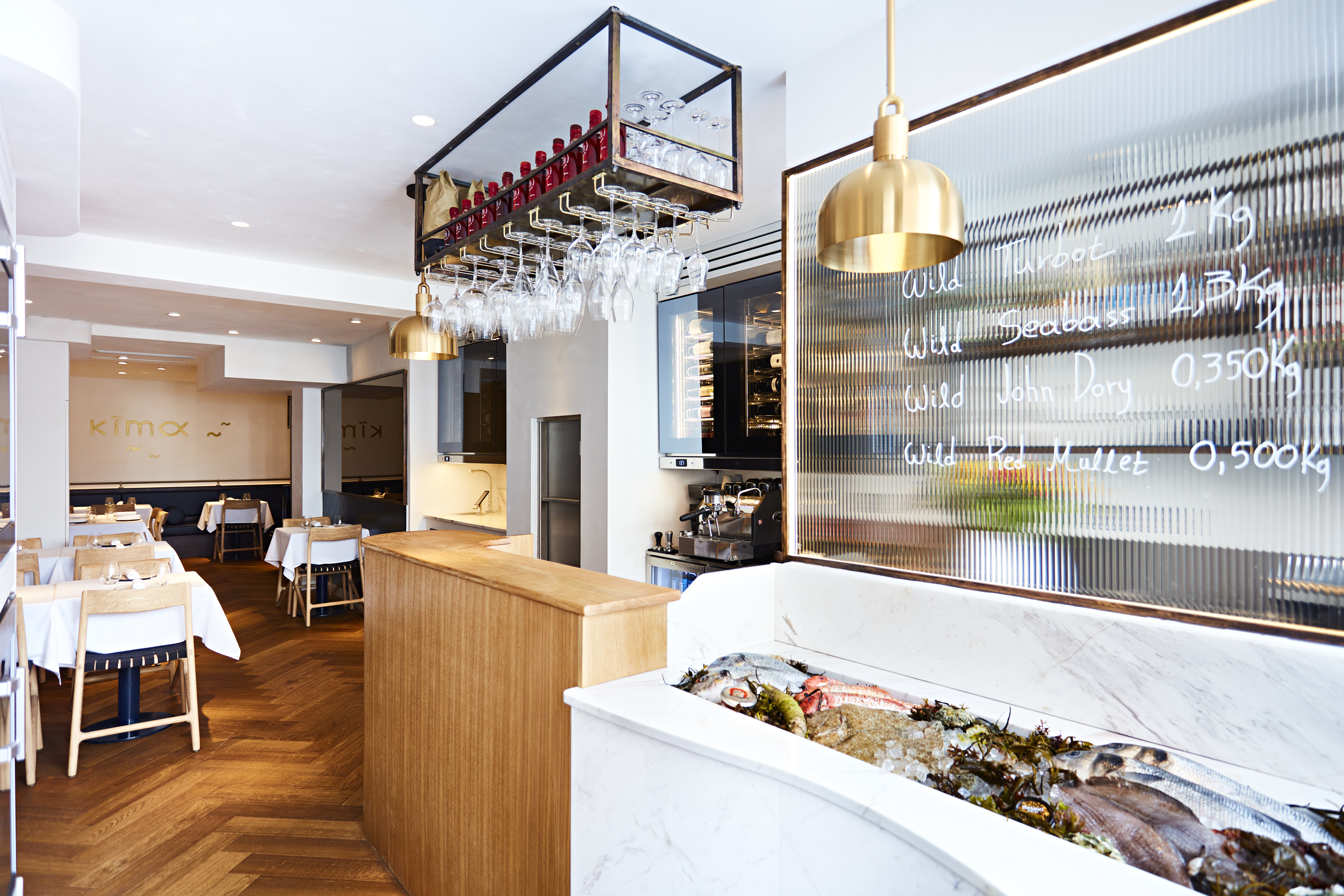 Private dining area in Kima Restaurant with elegant lighting for corporate events.