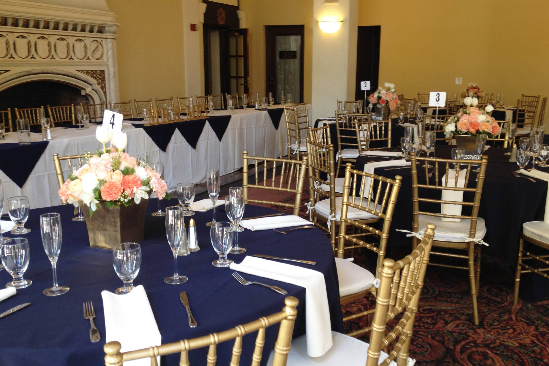 Elegant dining room with navy linens, perfect for weddings and corporate events.