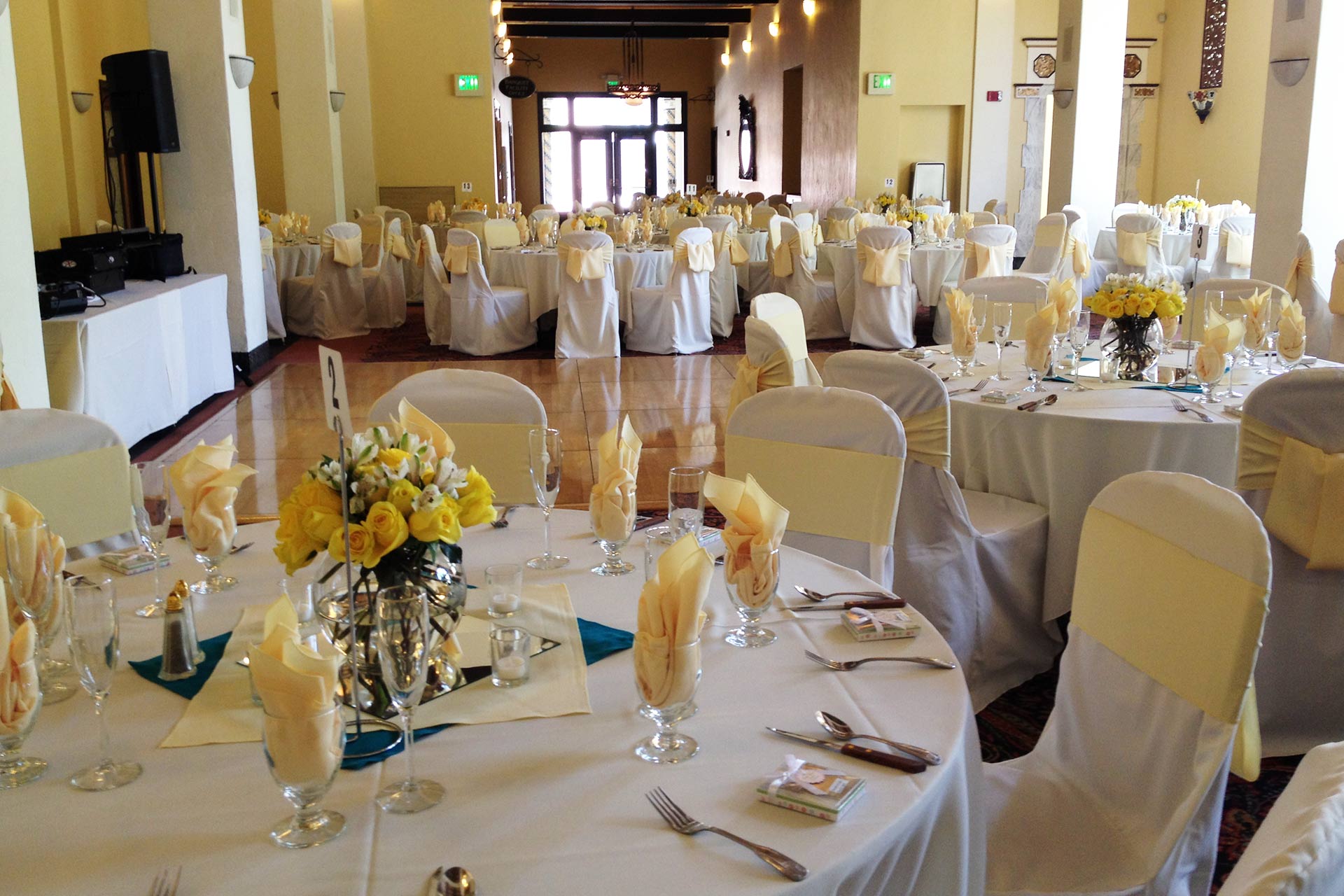 Elegant ballroom with round tables, perfect for weddings and formal events.