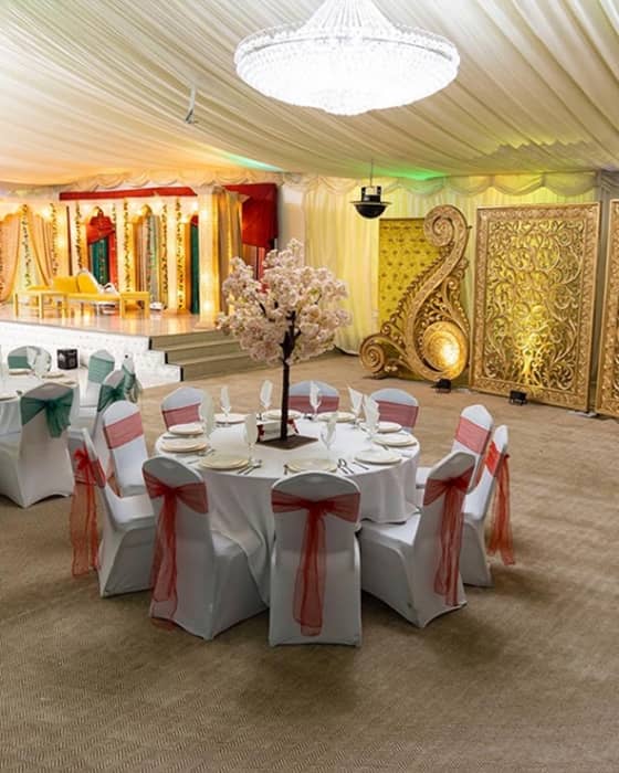 Elegant conference hall with cherry blossom centerpiece, ideal for events and celebrations.