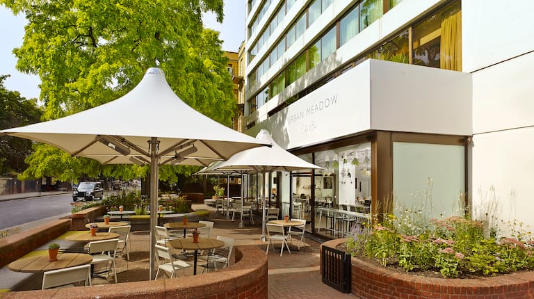 Outdoor dining area at DoubleTree by Hilton London, ideal for networking events.