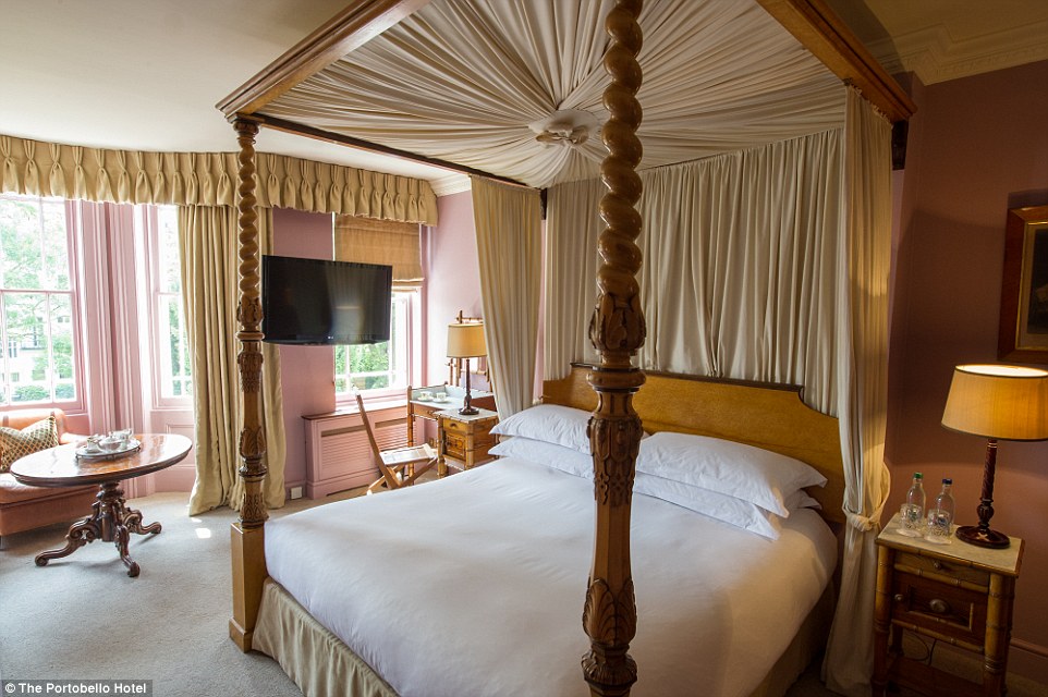 Outstanding Room at The Portobello Hotel with four-poster bed, perfect for retreats and meetings.