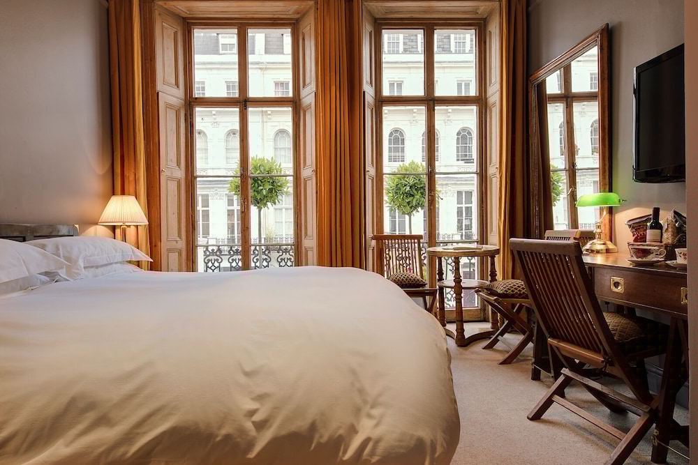 Outstanding Room at The Portobello Hotel, featuring elegant furnishings for meetings and retreats.