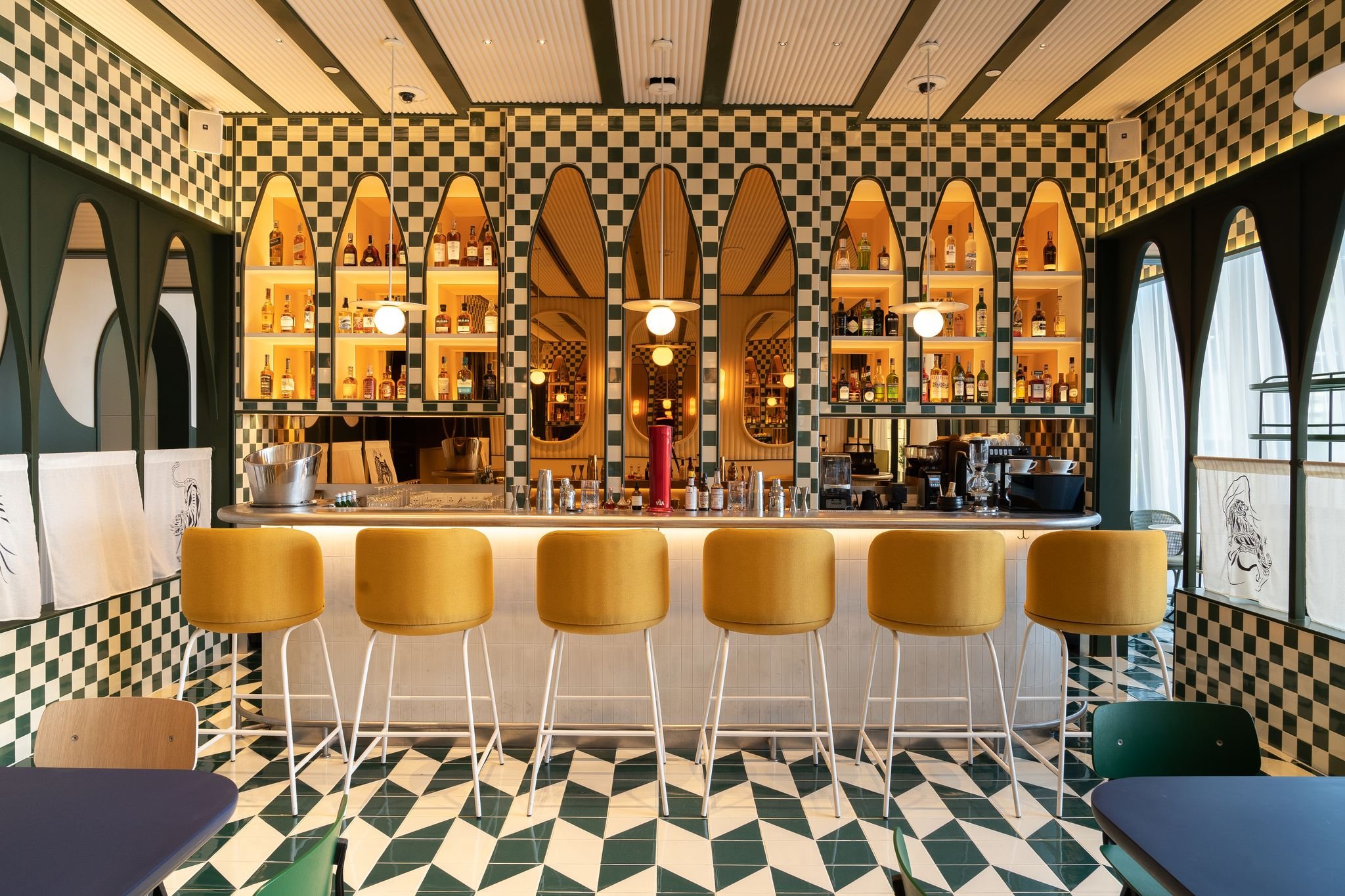 Stylish bar with vibrant decor at The Biergarten for events and gatherings.