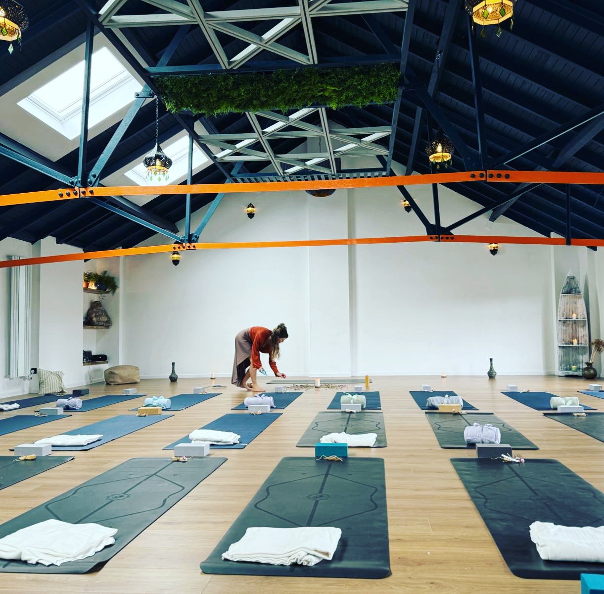 Serene yoga studio with natural light, perfect for wellness retreats and mindfulness workshops.