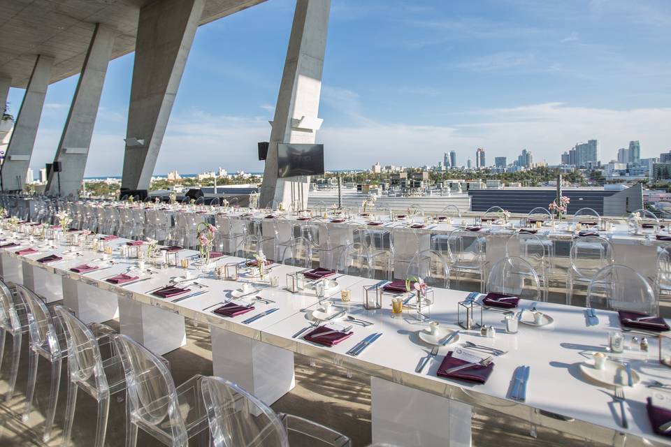 Rooftop event space at 1111 Lincoln Road, elegant dinner setup with city view.