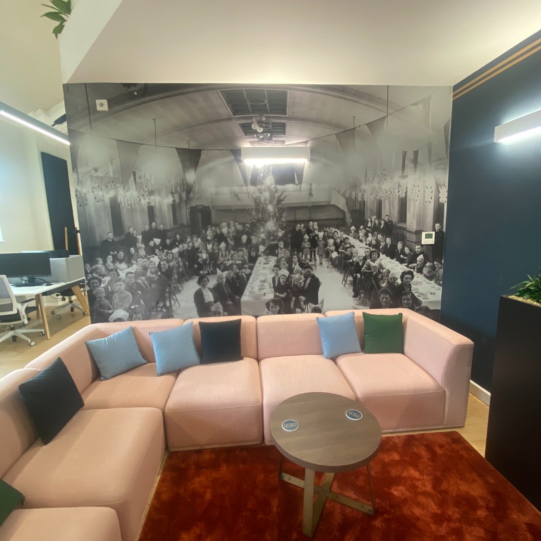 Stylish meeting room with historic mural, perfect for creative events in Rochdale.