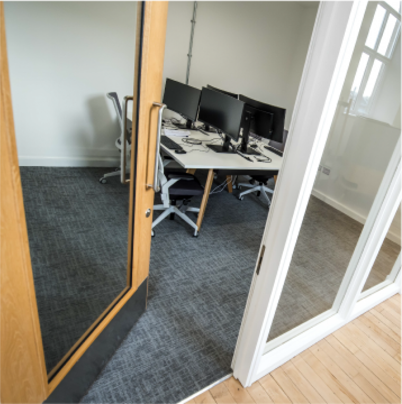 Modern meeting room in Fire Up Rochdale, ideal for collaboration and virtual meetings.