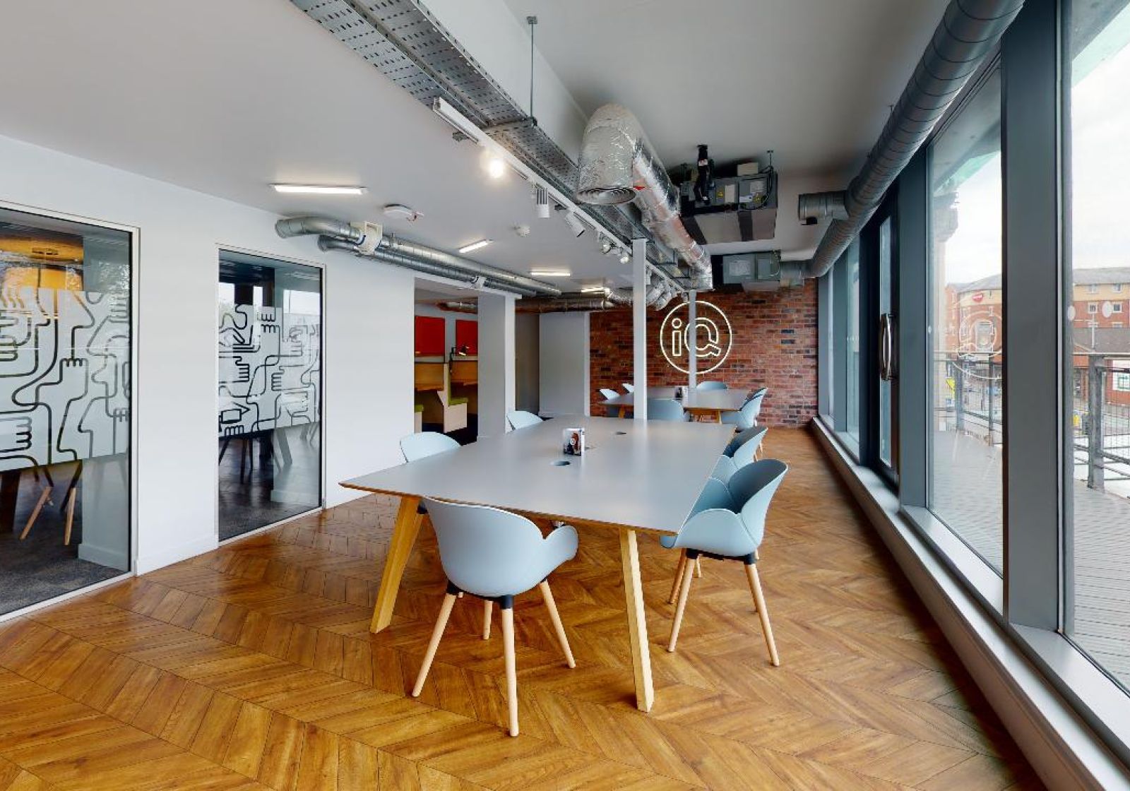 Modern meeting space in Wilmslow Conference Centre with spacious table and natural light.