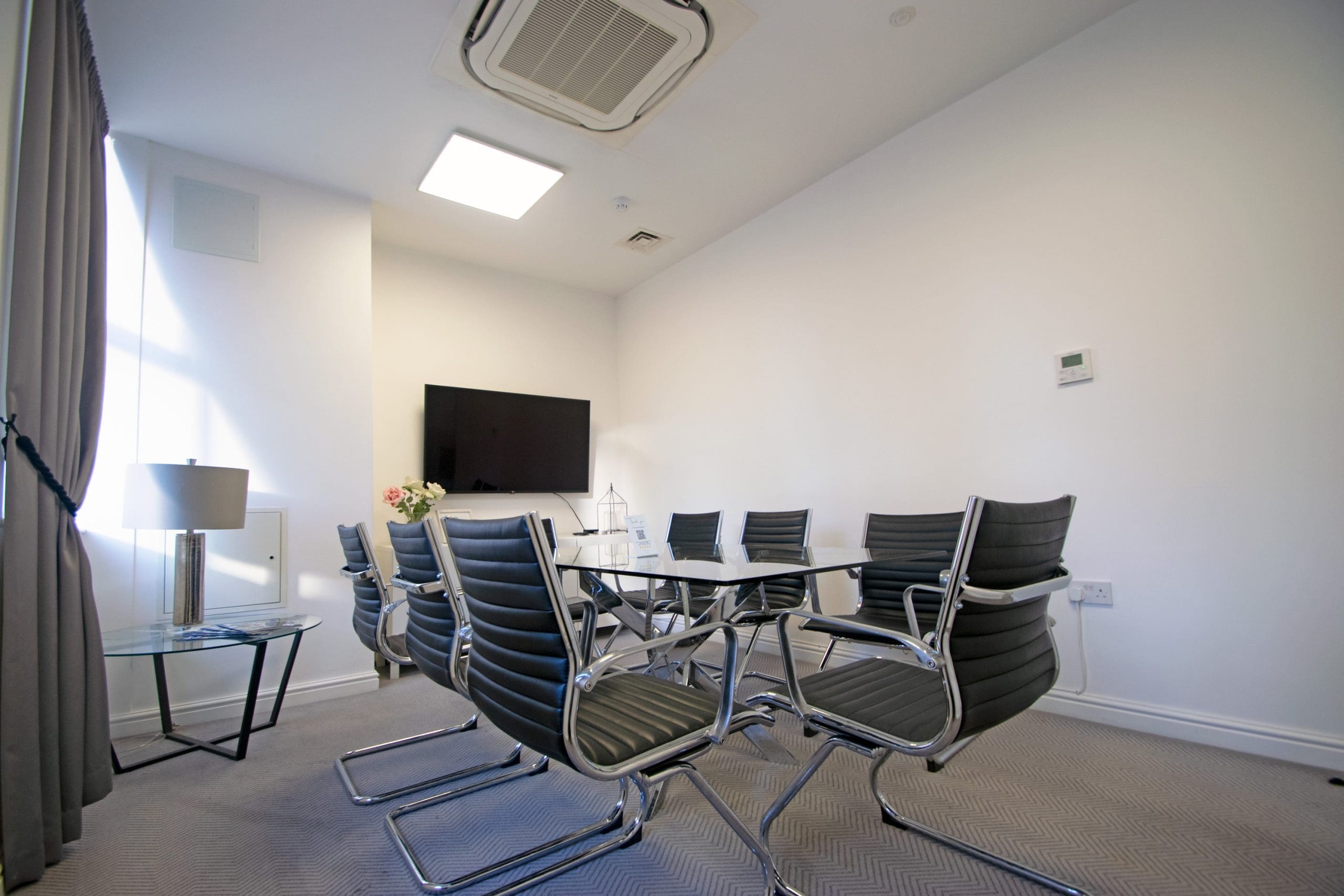 Modern meeting room at Grosvenor House, ideal for presentations and small gatherings.