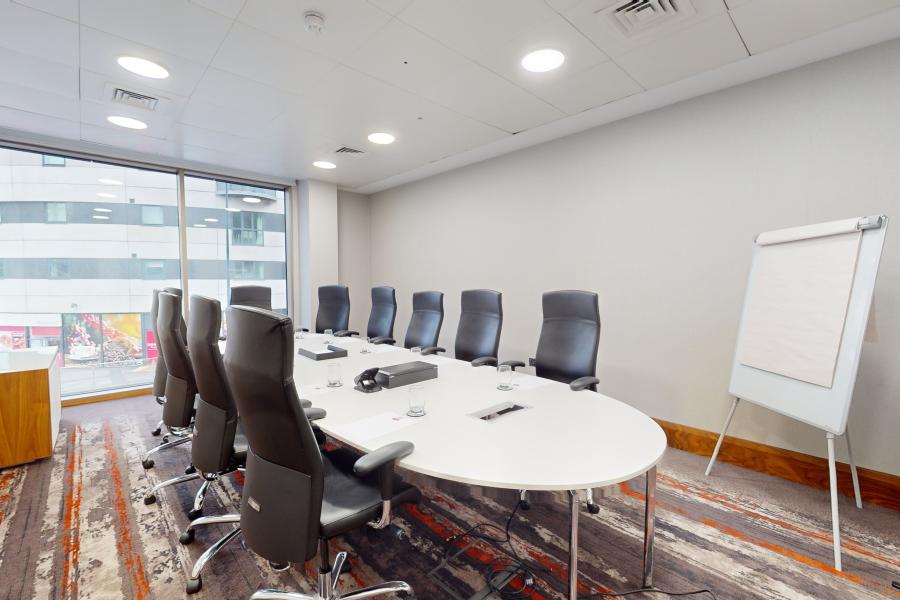 Modern conference room at Bar 11, Grosvenor House, ideal for meetings and presentations.
