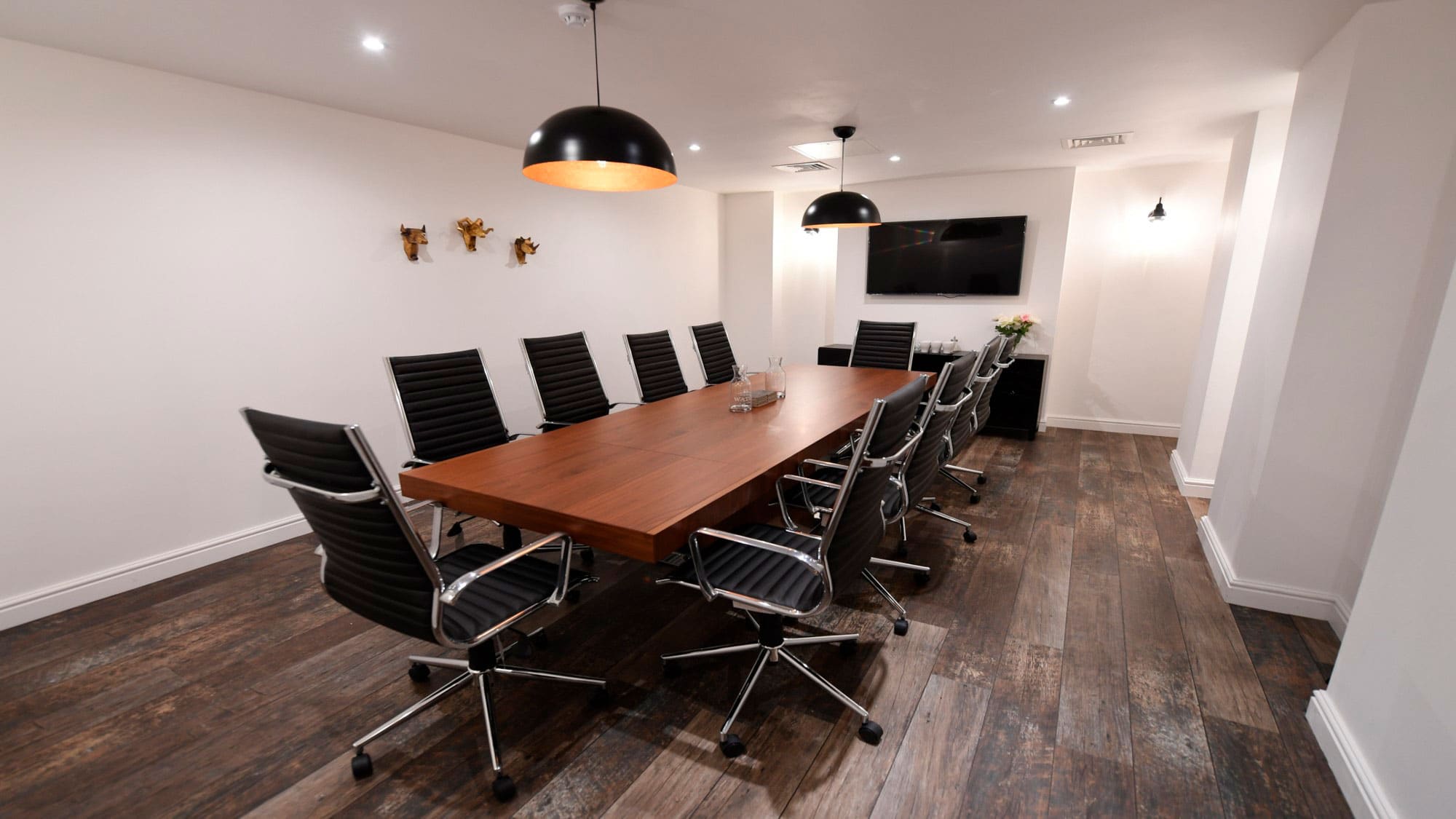 Modern Executive Boardroom at Grosvenor House with sleek wooden table for meetings.