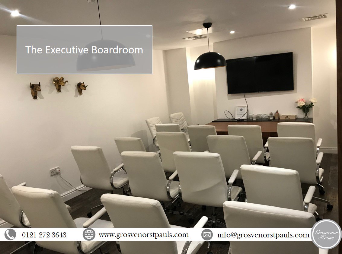 Executive boardroom at Grosvenor House with modern white chairs for corporate meetings.