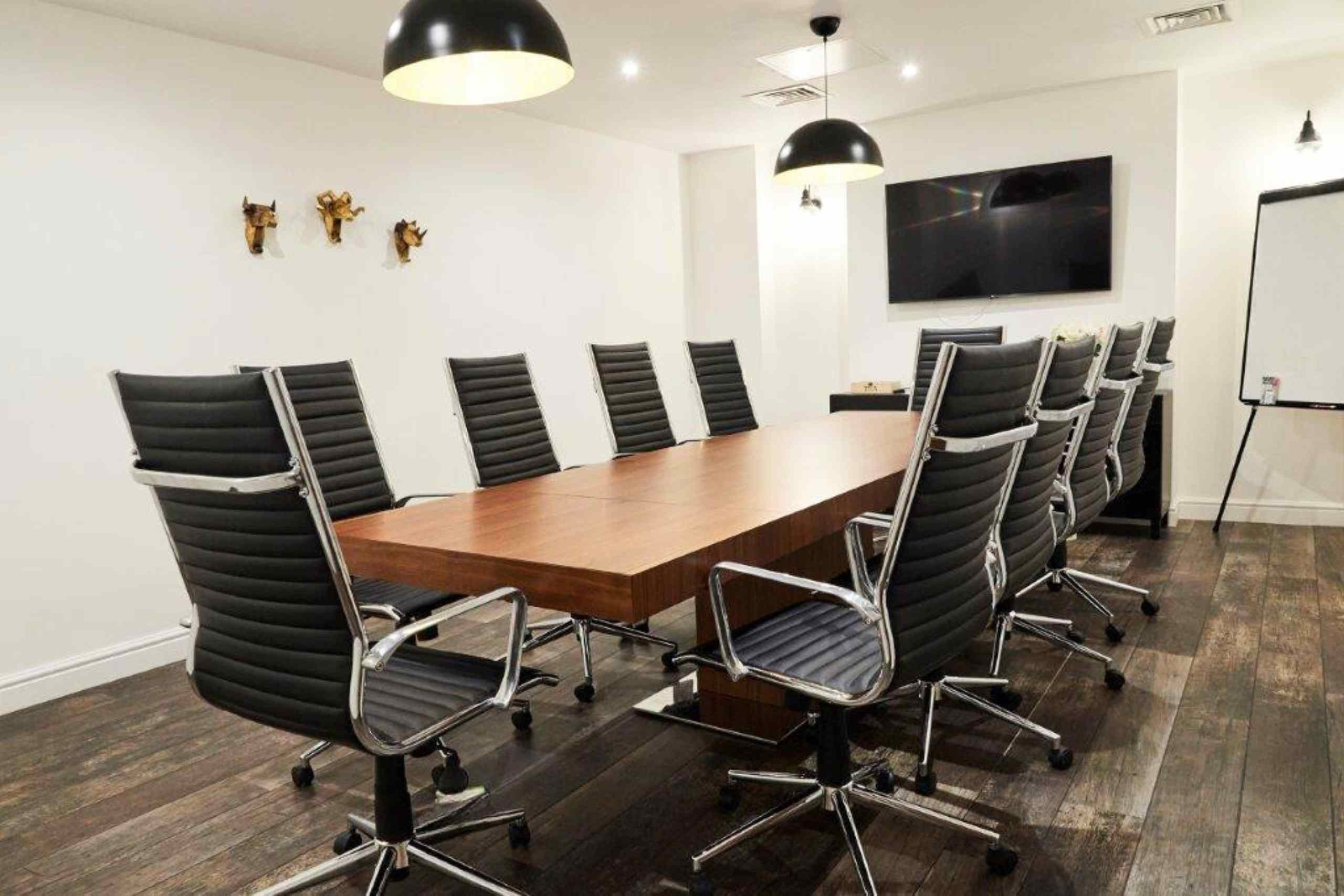 Modern Executive Boardroom with sleek table, ideal for professional meetings and workshops.
