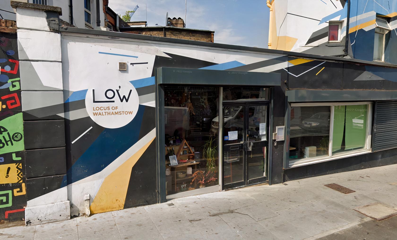 Vibrant modern venue with colorful mural for creative meetings and events.