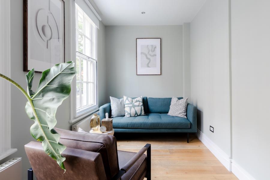 Stylish therapy room with natural light for intimate meetings and brainstorming sessions.