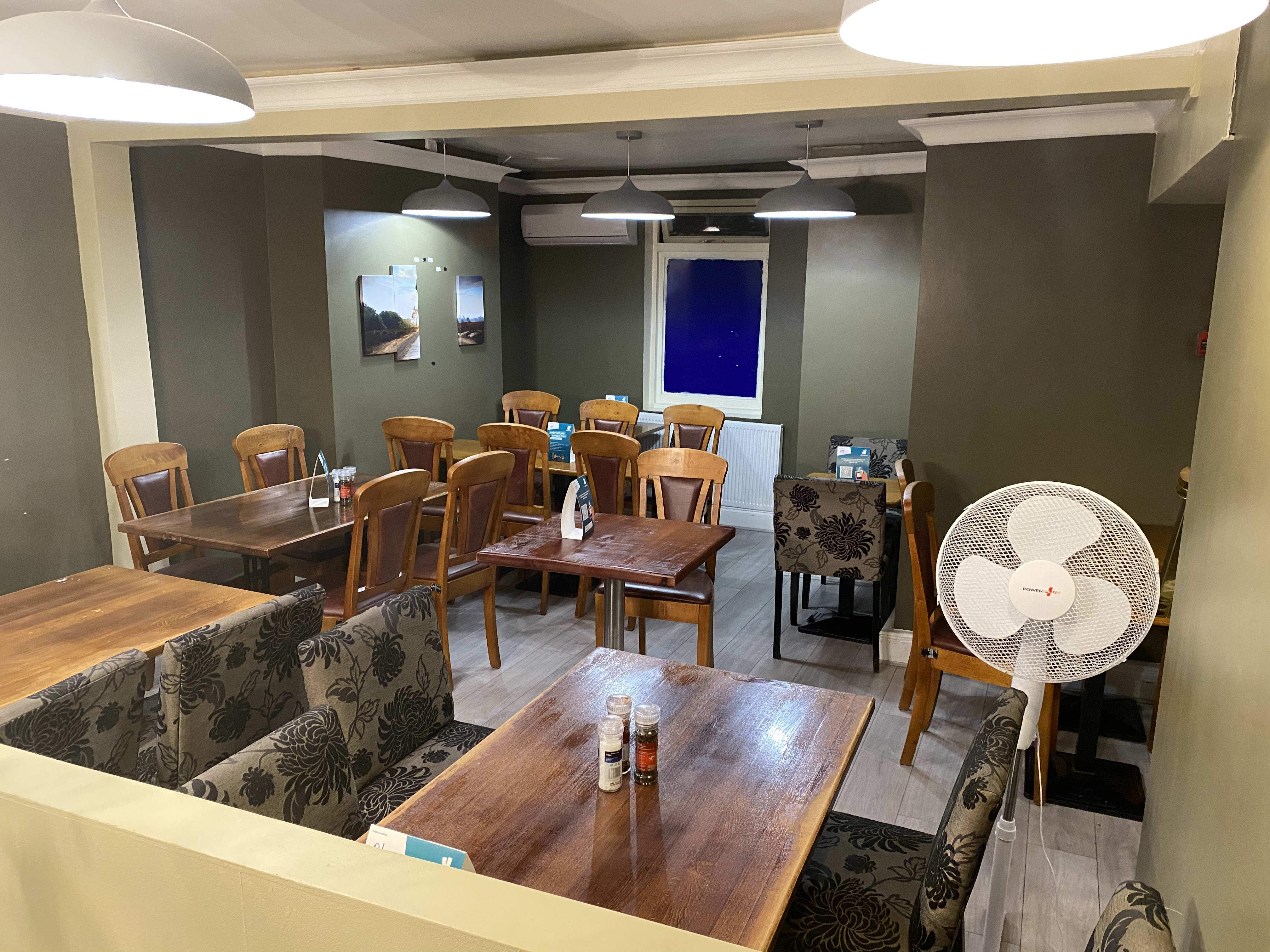 Cozy dining space in Calabash Restaurant, perfect for casual meetings and events.