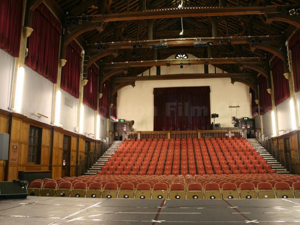 Live music venue in Harrow Arts Centre with wooden ceiling, ideal for conferences and presentations.
