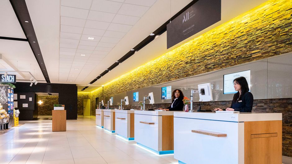 Modern reception area at Novotel Amsterdam City for efficient event check-in.