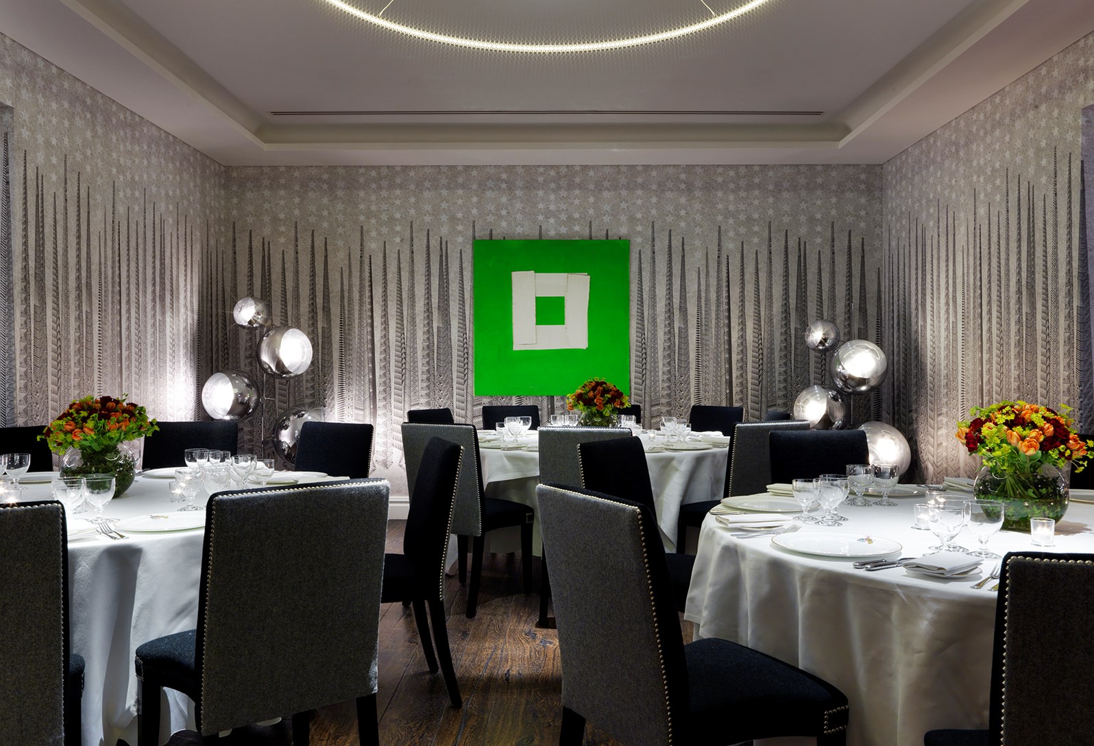 Elegant event space in Soho Hotel with floral centerpieces for upscale dinners and meetings.