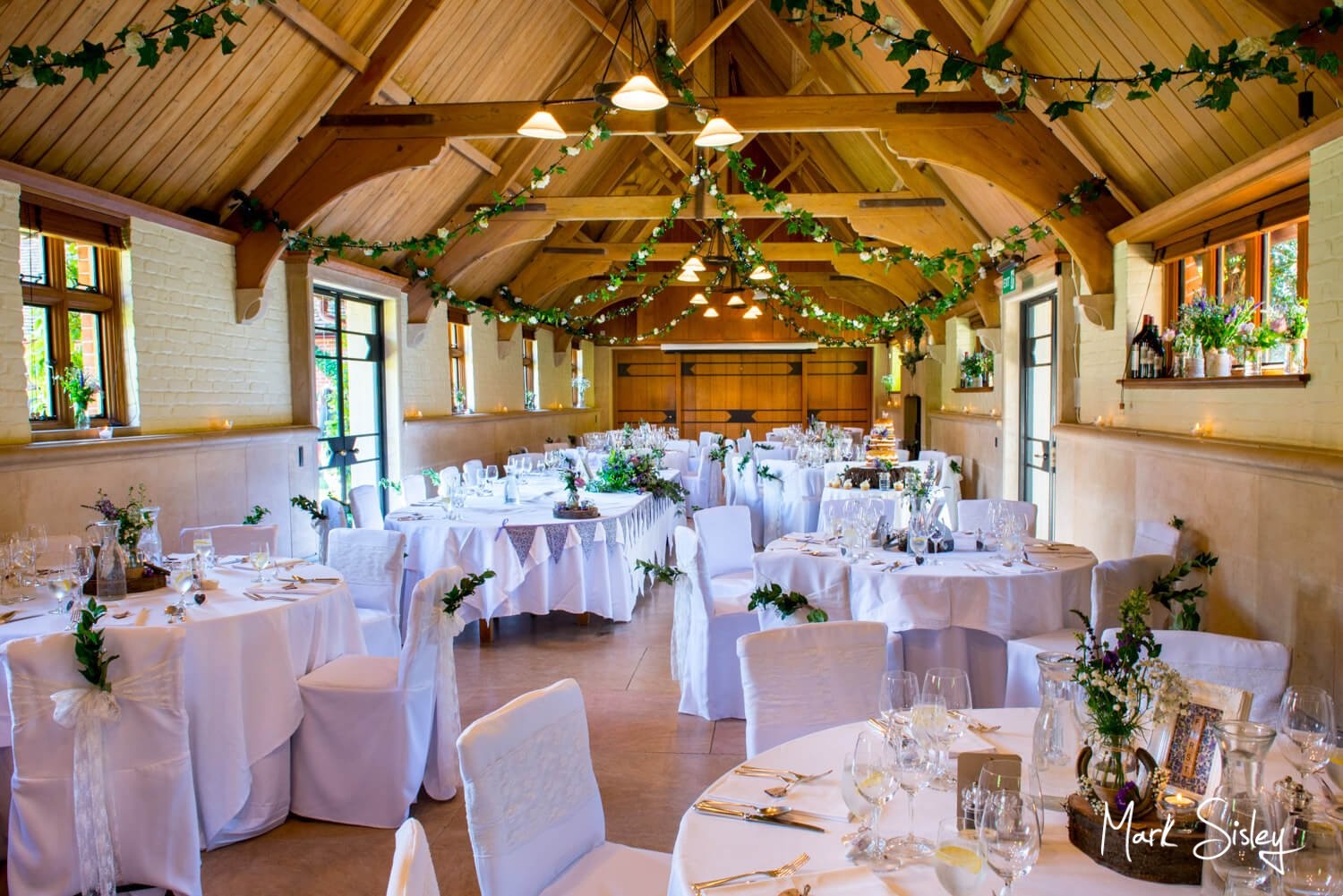 Elegant Main Hall at Waddesdon, ideal for weddings with floral centerpieces and natural light.