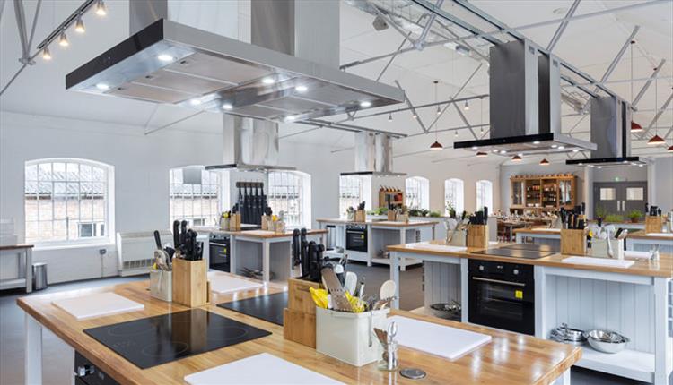 Modern kitchen venue for culinary events, featuring professional-grade appliances.