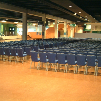 Surrey Hall at Sandown Park, spacious event space with blue chairs for conferences.