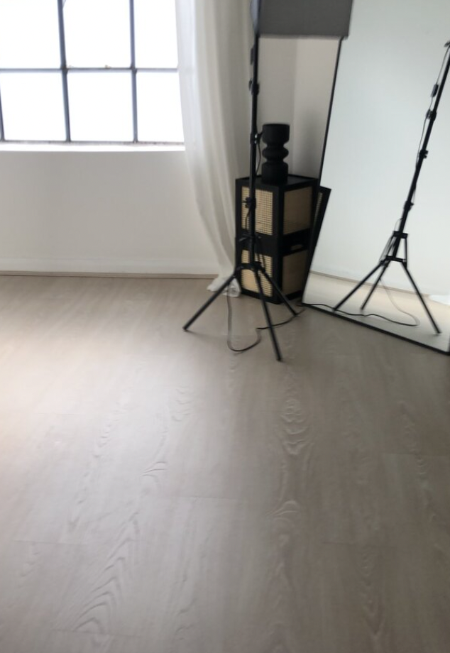 Minimalist event space in Sugar Studio Bristol with large mirror, ideal for workshops and gatherings.