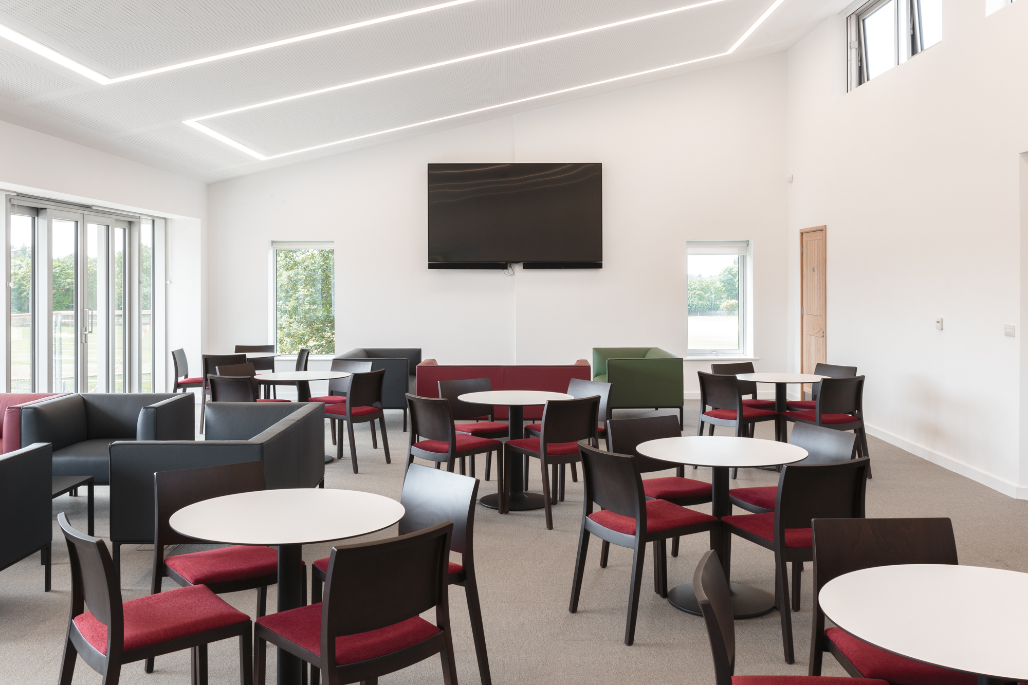 UCS New Pavilion Eve Lounge: modern meeting space with natural light for events and gatherings.