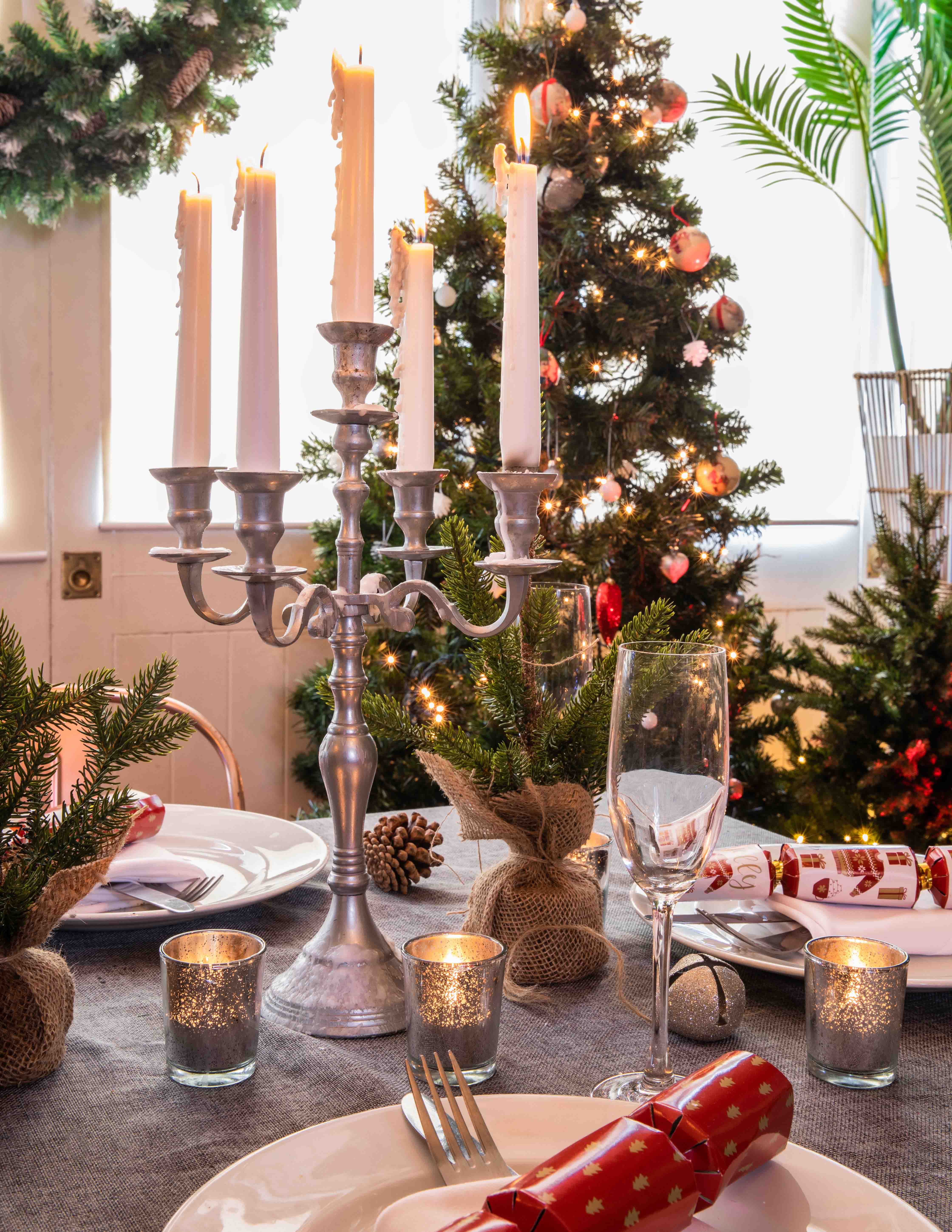 Elegant table setting with silver candelabra for festive Christmas event at The Little Blue Door.