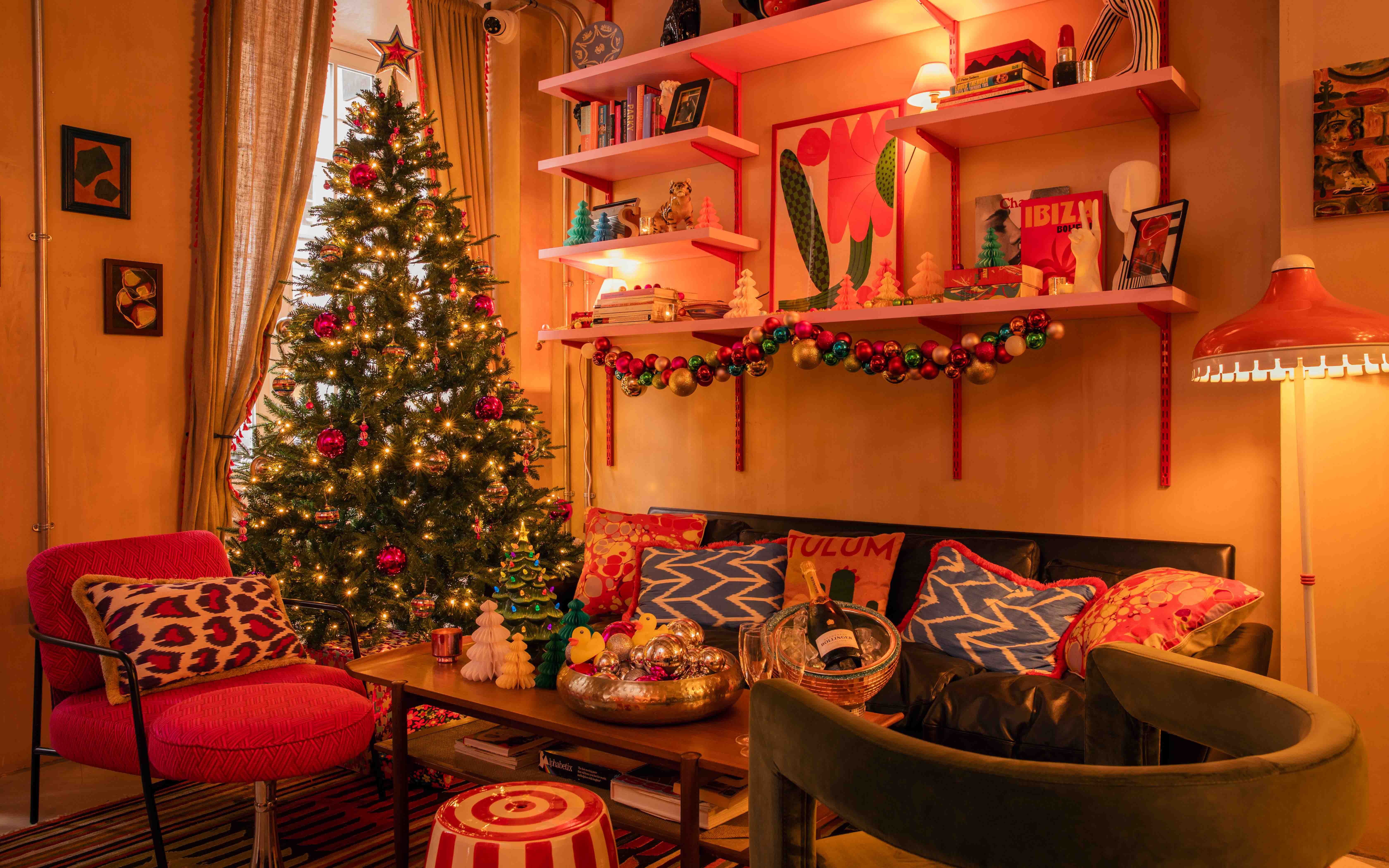 Cozy Christmas setting with decorated tree for holiday gatherings at The Little Scarlet Door.