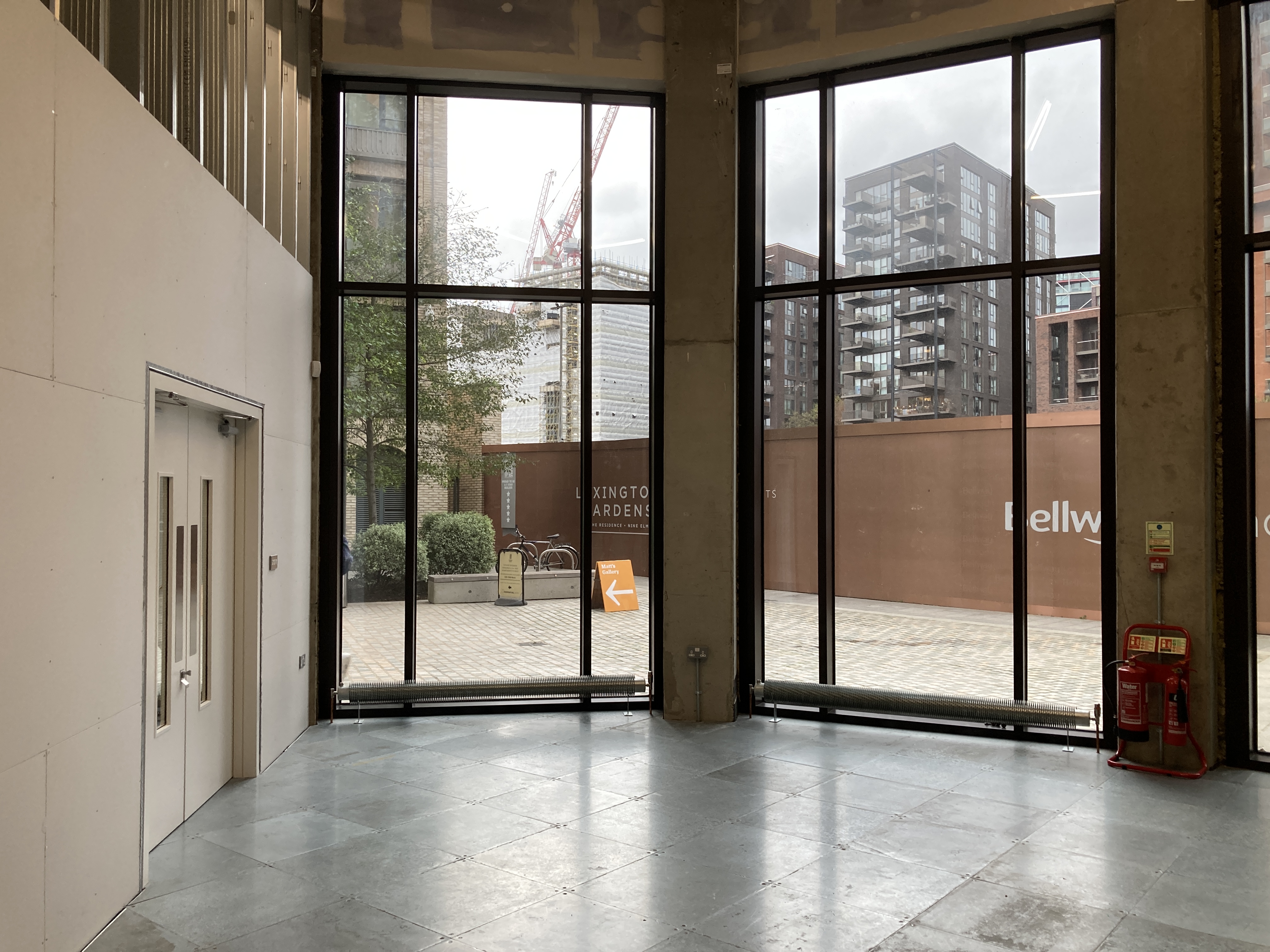 Modern event space with large windows, ideal for meetings and networking.