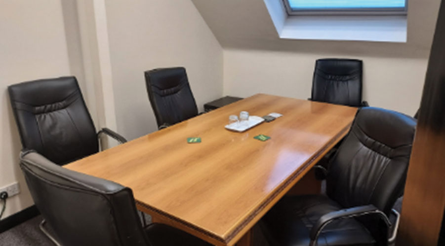 Malala Yousafzai in a modern meeting room for productive discussions and brainstorming.